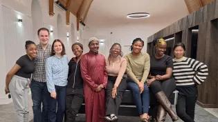 Students looking at the camera and smiling.