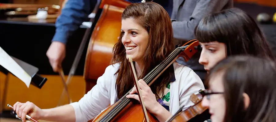 Student playing a cello.