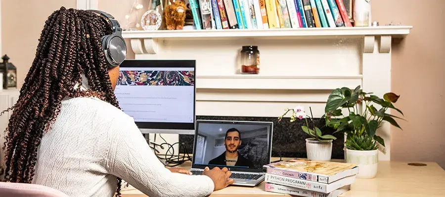 Student watching an online event.