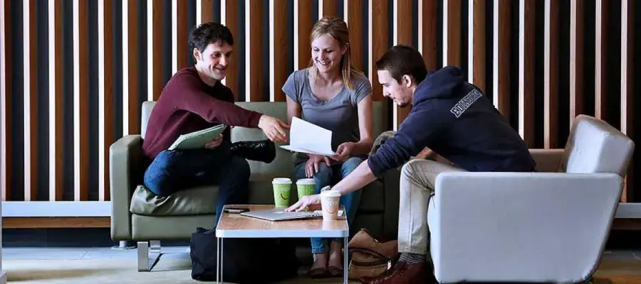 Students sitting inside campus building