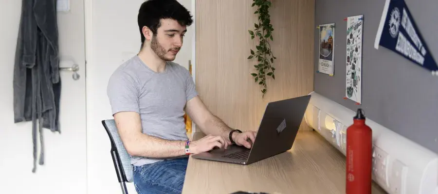 Student in a study bedroom in Fraser Court.