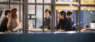 Students chatting with coffee.