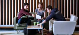 Students sitting inside campus building