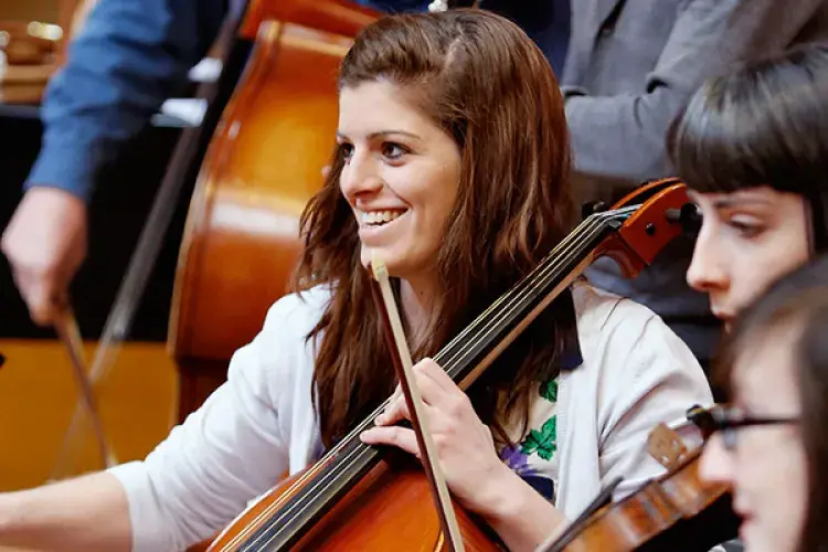 Student playing a cello.