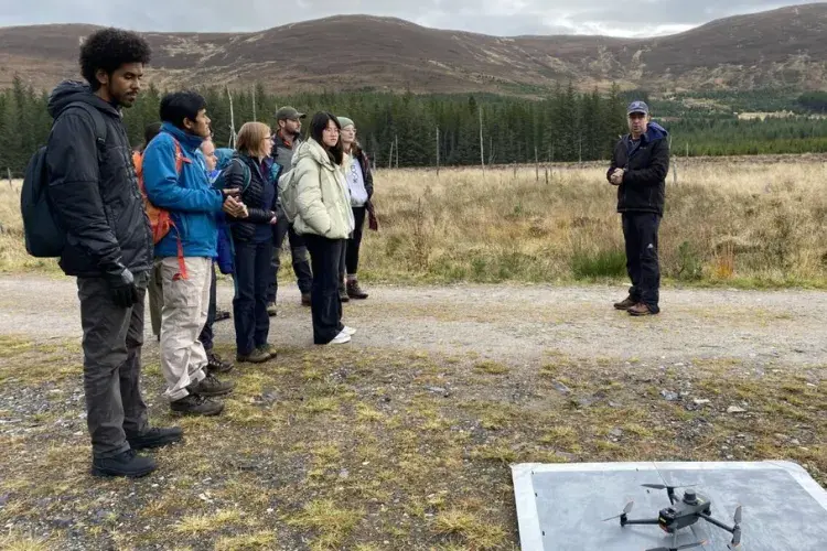 Students using drones during field work.