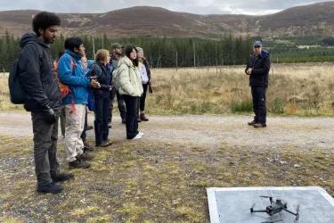 Students using drones during field work.