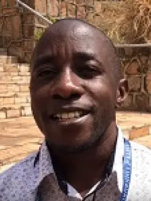 A headshot of One Health student, Salaviriuse Ahimbisibwe