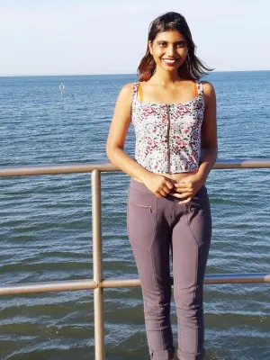 Graduate Prerna Deep stood by the ocean